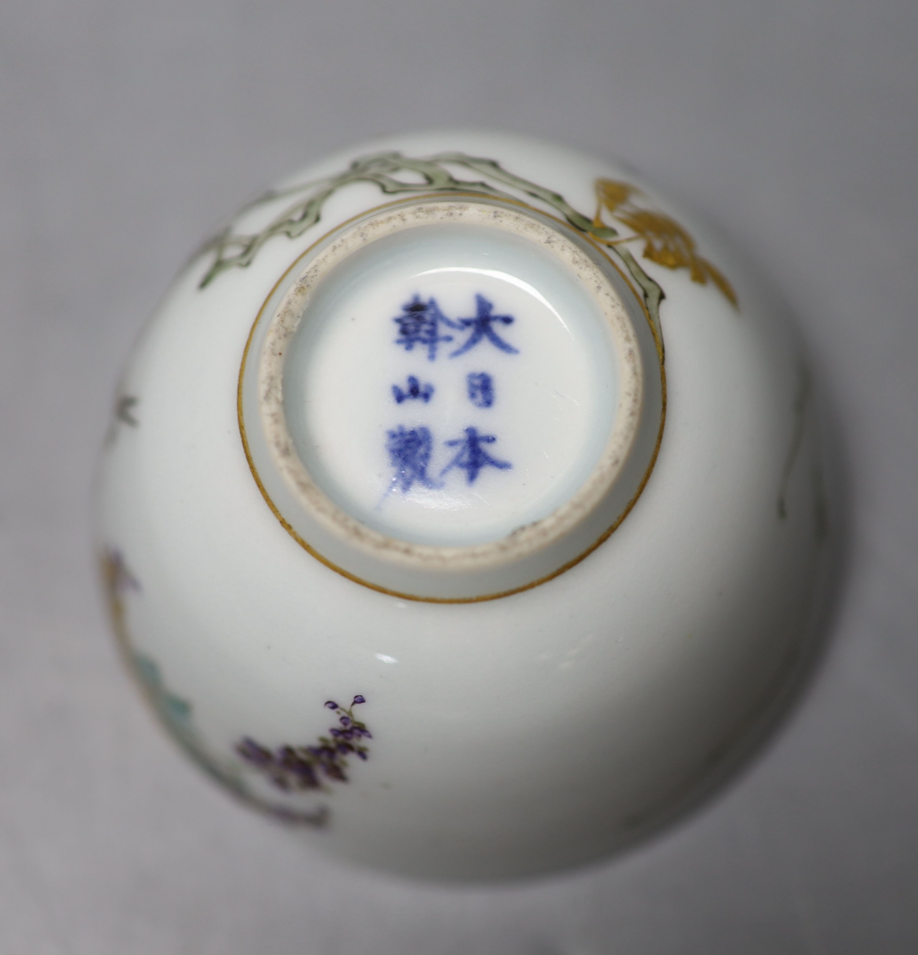 An unusual Japanese Kinkozan porcelain tea bowl, six character mark to base, Dia 8cm